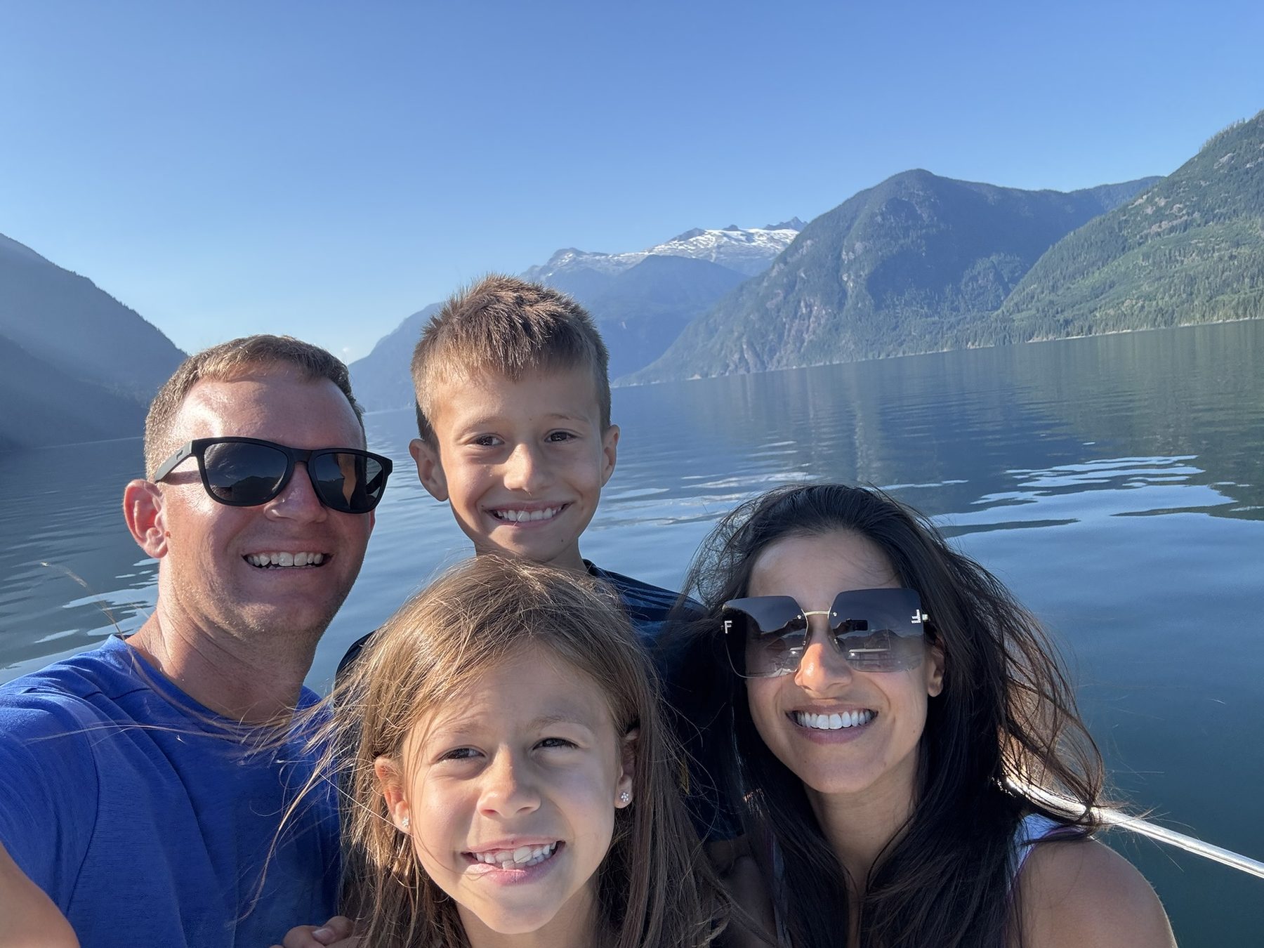Our family aboard the boat with British Columbia mountains behind us